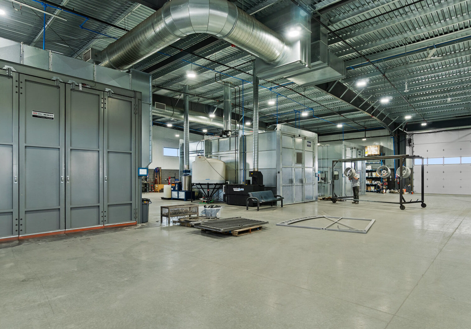 Spacious industrial warehouse with ventilation ducts and equipment